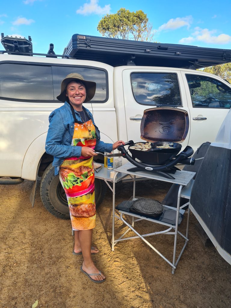 Double camp kitchen set up outdoors at a campsite